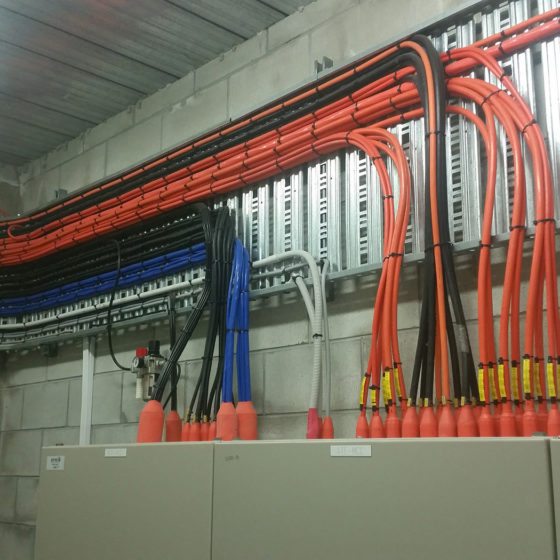 Red Black and blue wires through the room