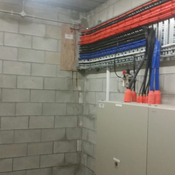 Red Black and blue wires through the room