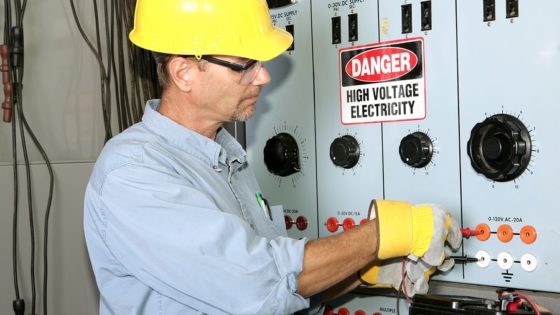 Man inspecting for faulty wire