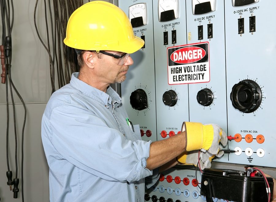 Man inspecting for faulty wire